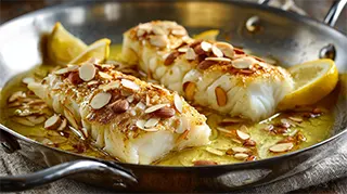 photo of cod armandine in a skillet on the stove