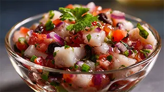 photo of cod ceviche with lime juice, tomatoes, jalapeno pepper