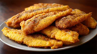 photo of deep fried crappie fillets in peanut oil with cornmeal coating
