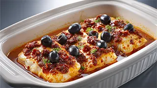 photo of mexican bass fillets with red salsa and black olives
