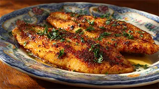 photo of sauteed smallmouth bass in butter and parsley