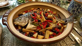 photo of steamed carp with bamboo shoots, black ham and diced pork